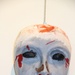 Service Member's Mask Reflects Grief Over Squad Mates' Deaths