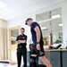 Injured Army Officer Tests Exoskeleton Brace at Rehab Center