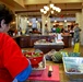 Volunteer Prepares Meals at Warrior and Family Support Center