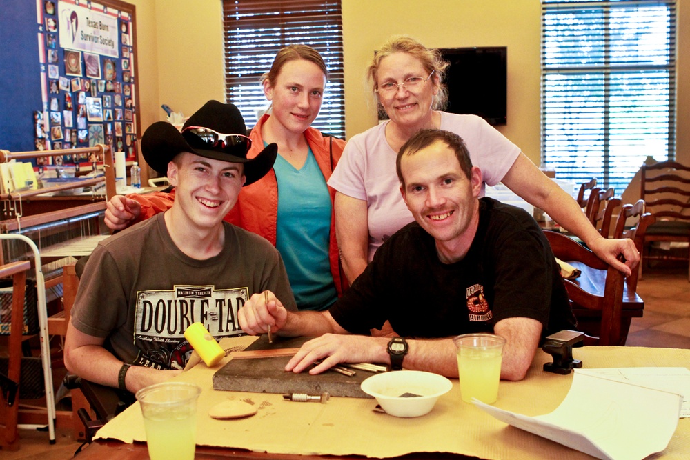 Soldier Pauses for Family Photo at Support Center