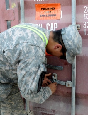 Army Sgt. Seals Container After Customs Inspection in Iraq