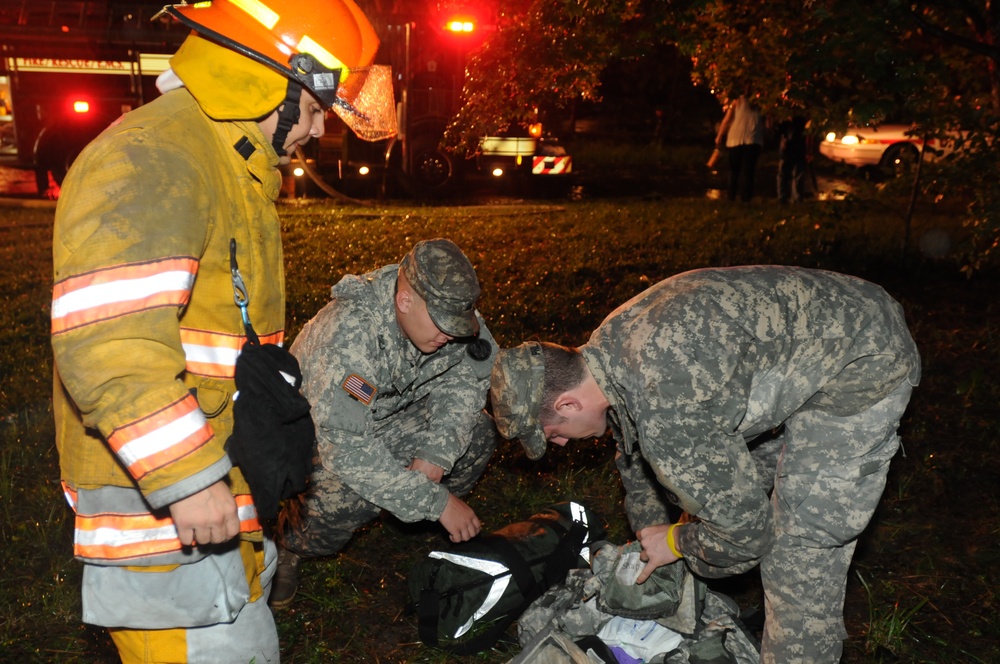National Guard Medics Assist Firefighters at House Fire After Hurricane Irene