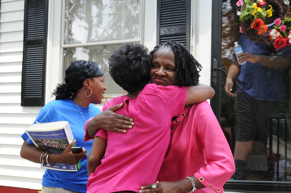 Former Shelter Resident Embraces Navy Veteran Receiving New Home from Extreme Makeover