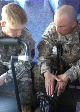 Father and Son Soldiers Train on M249 Weapon in Iraq