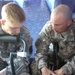 Father and Son Soldiers Train on M249 Weapon in Iraq