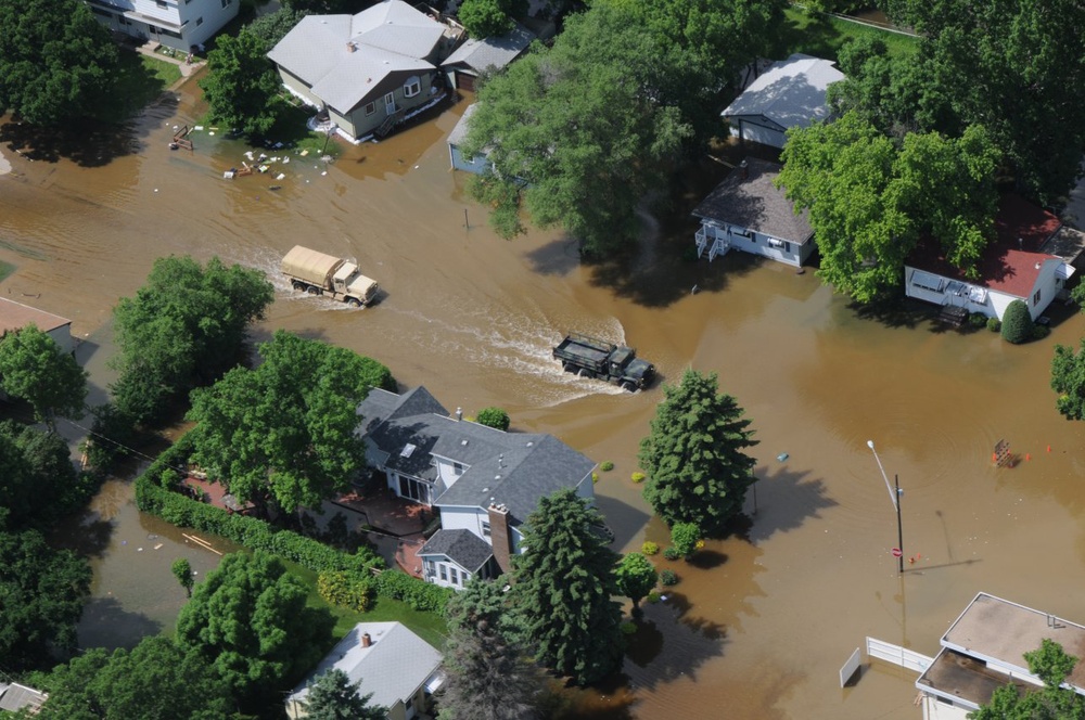 North Dakota National Guard Patrols Mandatory Evacuation Zones as Souris River Floods Minot