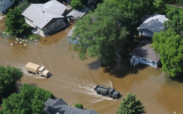 North Dakota National Guard Patrols Mandatory Evacuation Zones as Souris River Floods Minot