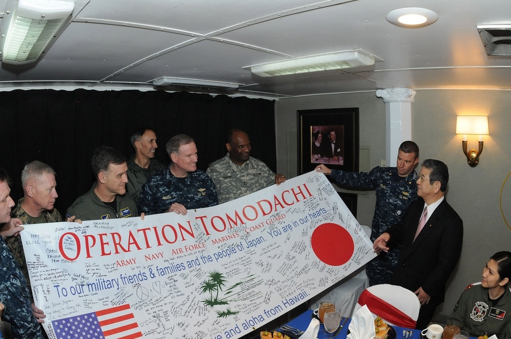 U.S. Pacific Fleet Commander Presents Japanese Defense Minister with Banner During Operation Tomodachi
