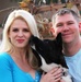 Retired Army Captain and Wife Pose with Dog