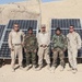 Marines, Sailors and Afghan Troops Pose with Solar Panels in Afghanistan