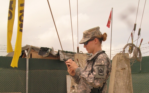 Army Pfc. Adjusts Cables on Rapid Aerostat Tower at Bagram Airfield