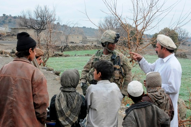 Army Sgt. Engages With Afghan Villagers During Patrol