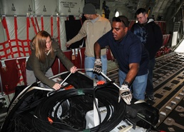 Air Force Airmen Prepare C-130J for Humanitarian Aid Airlift to North Africa