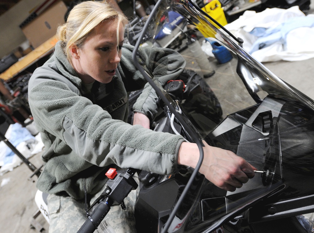 Alaska National Guard Soldier Preps Snowmobile for Iron Dog Race