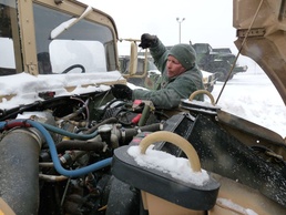 Missouri National Guard Soldier Performs Maintenance Checks on Tactical Vehicles