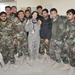 Teacher Judy Ryan Poses with Afghan Students at Remote Base