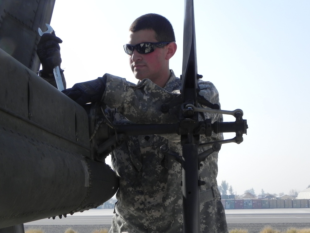 Army Mechanic Maintains Kiowa Helicopter in Afghanistan