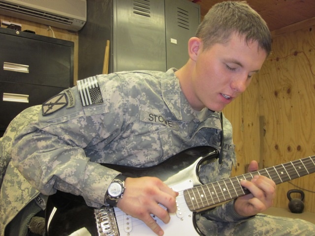 Soldier Serenades Comrades at Afghan Outpost