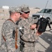 National Guard Officer Discusses Spectrum Analyzer Measurements with Convoy Escort Team in Iraq
