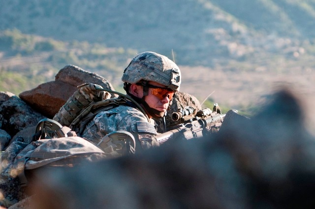 Army Sergeant Checks on Soldiers During Firefight in Afghanistan