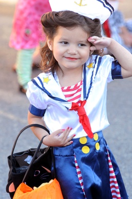Young Girl Dresses Up in Sailor Costume at Fort Bragg Festival