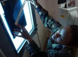 Air Force Technician Measures Mammogram Film to Detect Breast Cancer