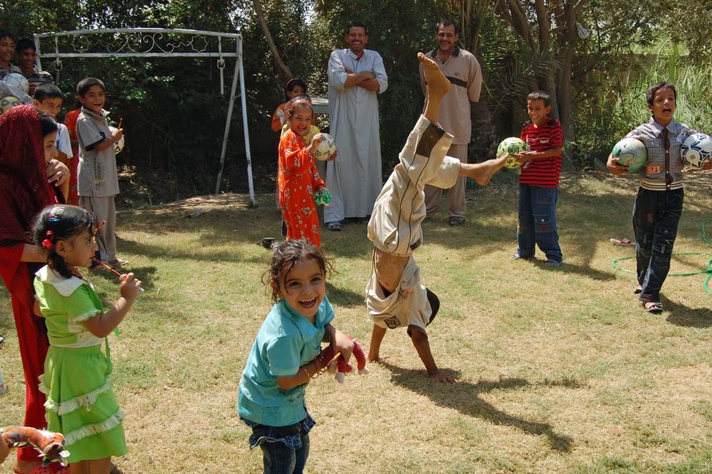 Iraqi Youth Showcases Acrobatic Skills After Receiving Soccer Ball Donation