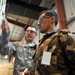 Afghan Guard and U.S. Soldier Collaborate at Parwan Detention Facility