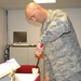 Arizona Air National Guard Chaplain's Assistant Prepares for Catholic Mass