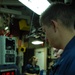 Submarine Commander Monitors Controls During Patrol