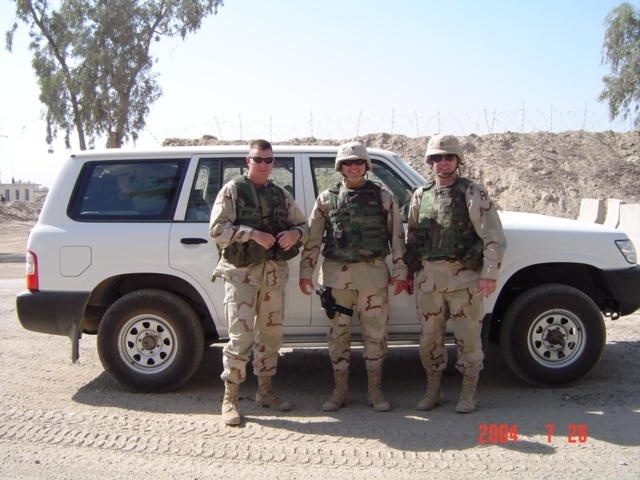 Retired Army Maj. Ed Pulido Poses with Noncommissioned Officers in Iraq