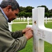 Tunisian Stone Mason Refreshes Gold Leaf on American Soldier's Gravestone