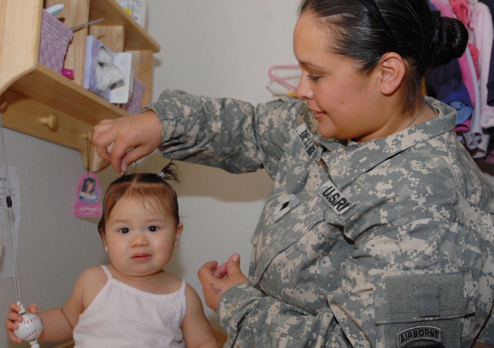 Army Spouse Cares for Children While Husband Serves Elsewhere