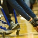 Navy Basketball Player Races Down Court in Wheelchair Basketball Game