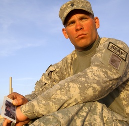 Soldier Holds Photo of Best Friend Killed in Combat