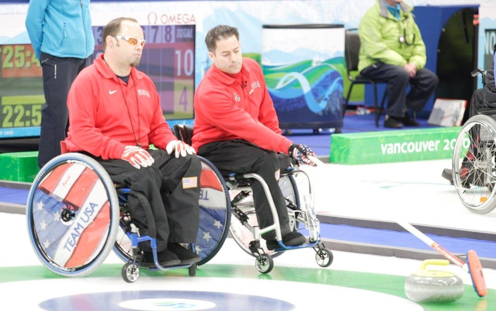 U.S. Paralympic Curling Team Strategizes During Match Against Norway