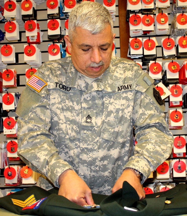 Fallen Soldiers Honored: Sgt. Toro Prepares Uniforms for Remains at Dover AFB