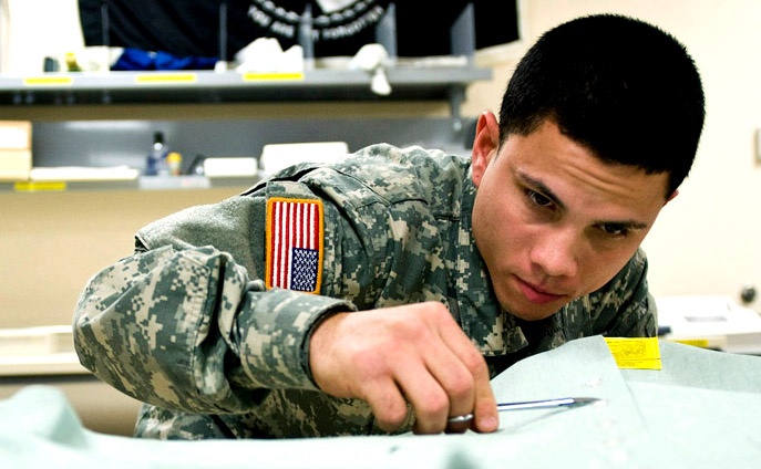 Honoring the Fallen: Soldier Prepares Uniforms for Remains at Dover Air Force Base