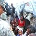 Airborne Soldier Connects with Haitian Child in Tent City