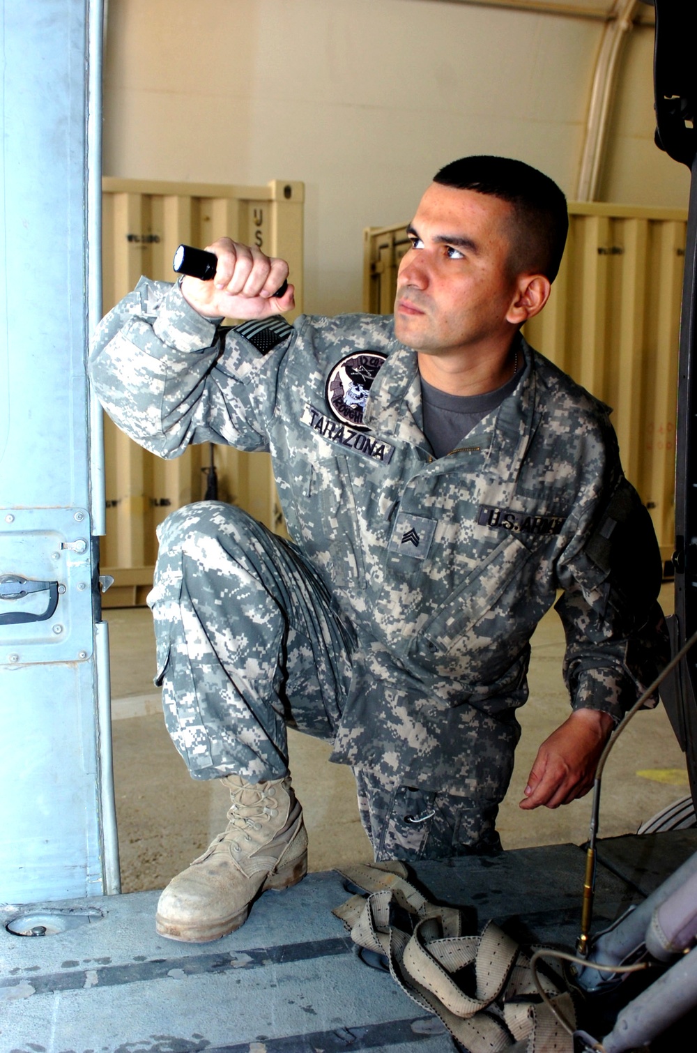 Army Sgt. Inspects Black Hawk Helicopter in Iraq