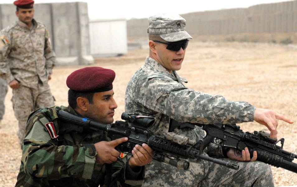 U.S. Soldier Trains Iraqi Counterpart at Combat Outpost in Iraq