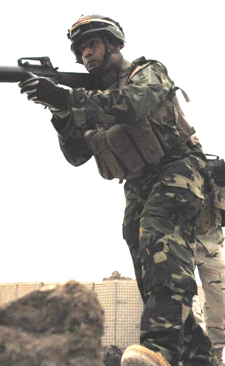 Iraqi Soldier Practices Room Clearing at Combat Outpost