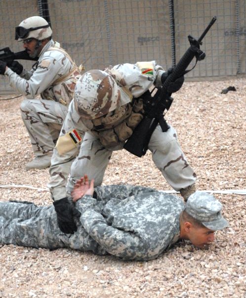 Iraqi Soldier Practices Detainee Securing Procedure
