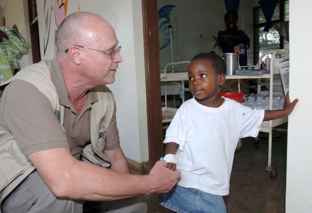 Air Force Doctor Treats Young Patient in Kenya Clinic