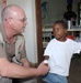 Air Force Doctor Treats Young Patient in Kenya Clinic