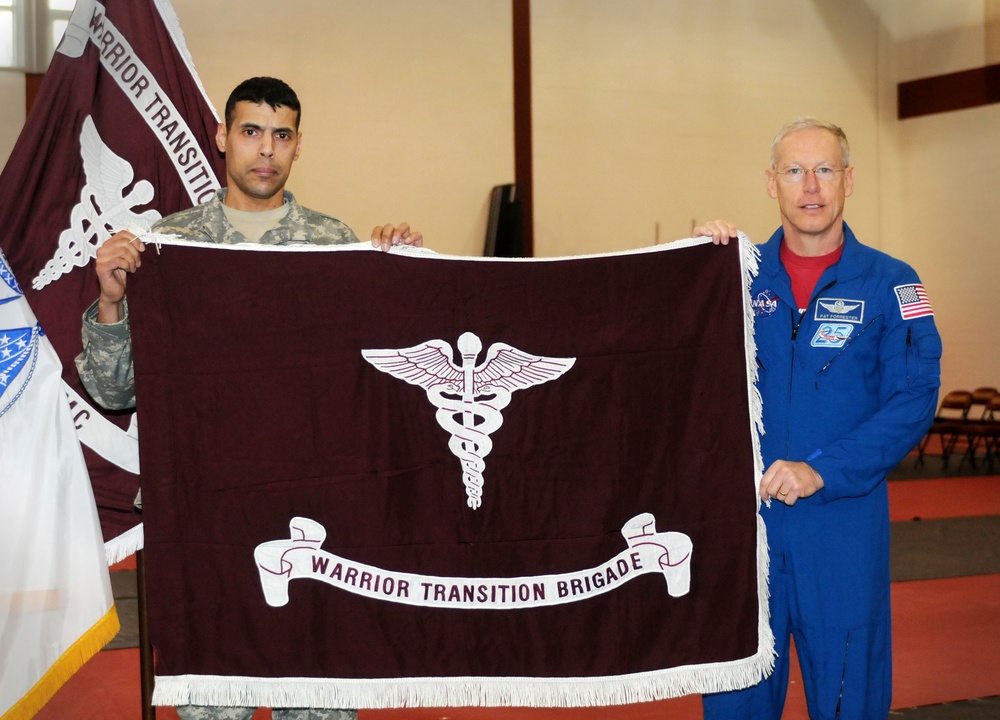 Astronaut Presents Space Station Flag to Wounded Soldiers