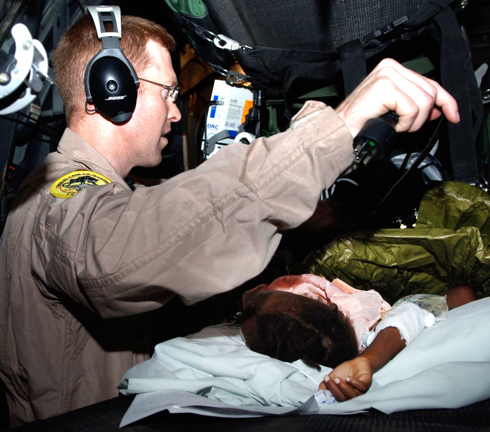Air Force Doctor Evacuates Child Earthquake Victim from Haiti