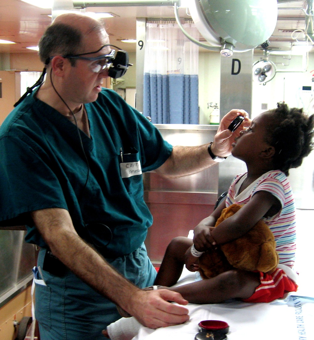 Navy Doctor Provides Eye Exam to Haitian Girl Evacuated After Earthquake