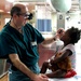 Navy Doctor Provides Eye Exam to Haitian Girl Evacuated After Earthquake