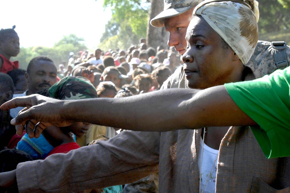 Haitians Organize Food Distribution with U.S. Troops in Port-au-Prince
